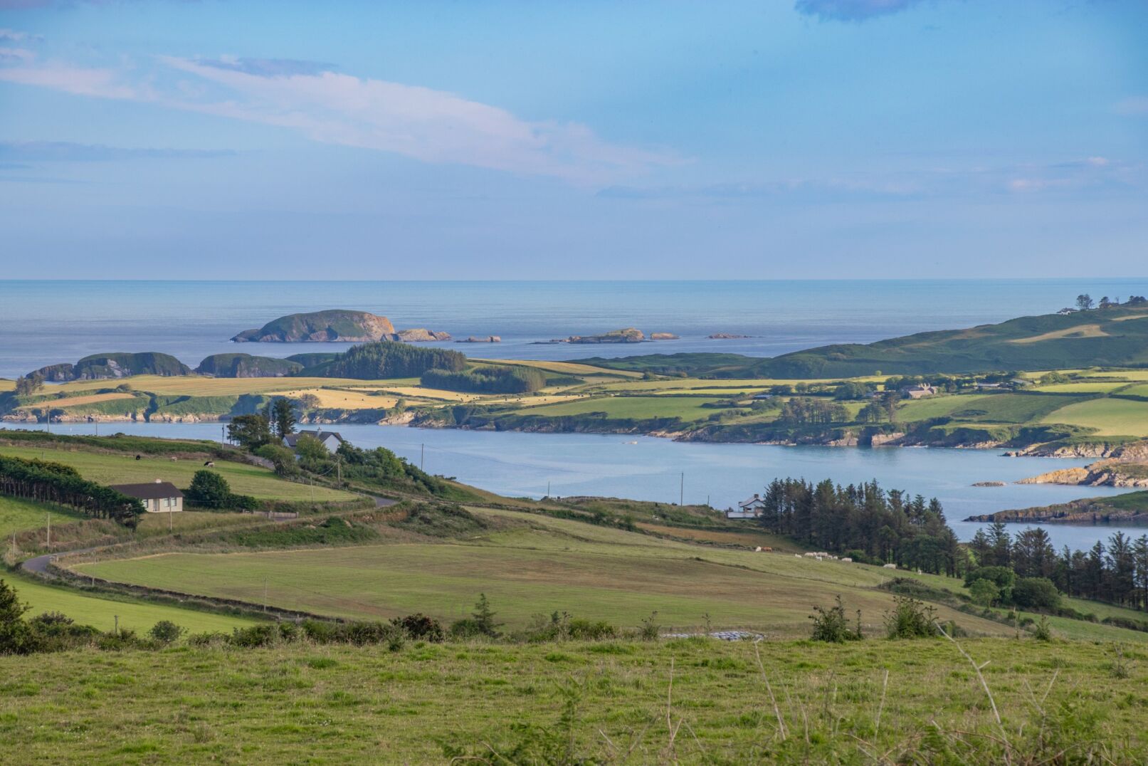 Farm fields with estuary and coastline in background